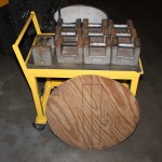 Calibration cart shown with (10) 50 lb. calibration weights and platter – The calibration weights on the cart are at an ergonomic height of 31” above floor level.