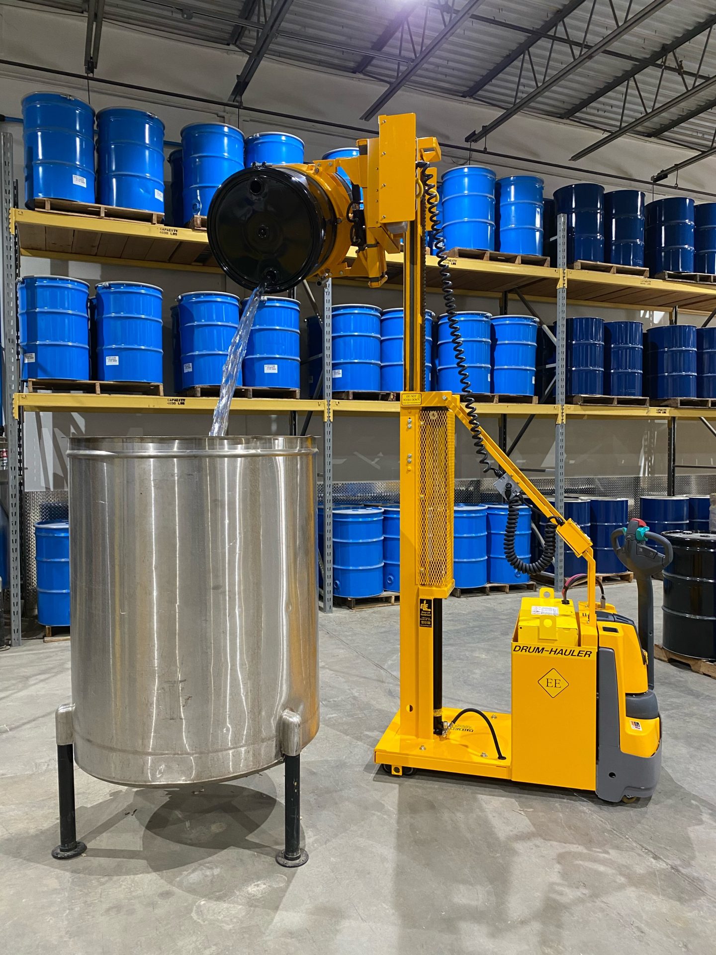 05-Drum-Hauler-with-2-stage-Mast-and-CR-Clamp-pouring-steel-drum