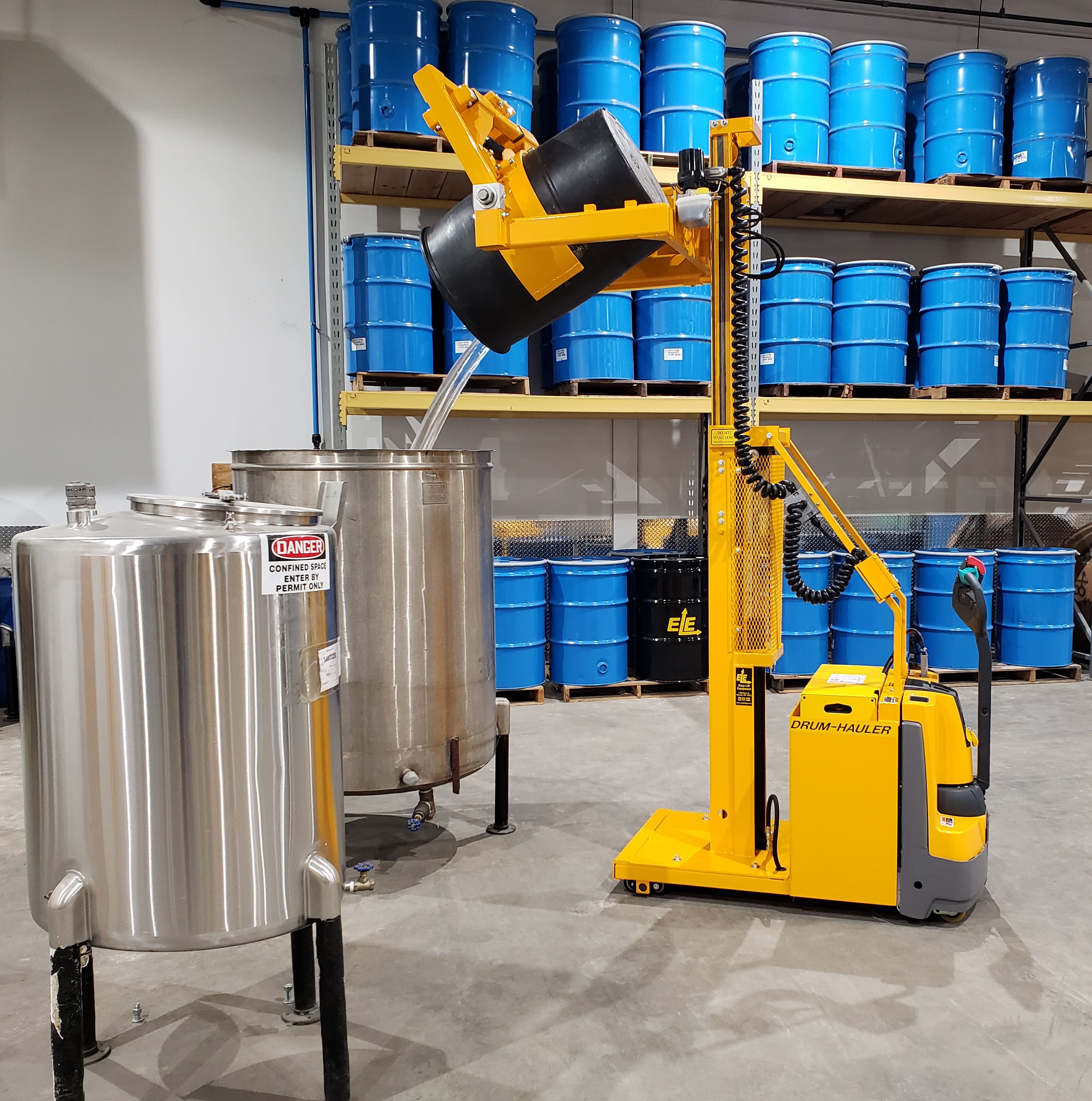 02-Drum-Hauler-with-2-stage-mast-and-drum-being-poured-in-tank-min