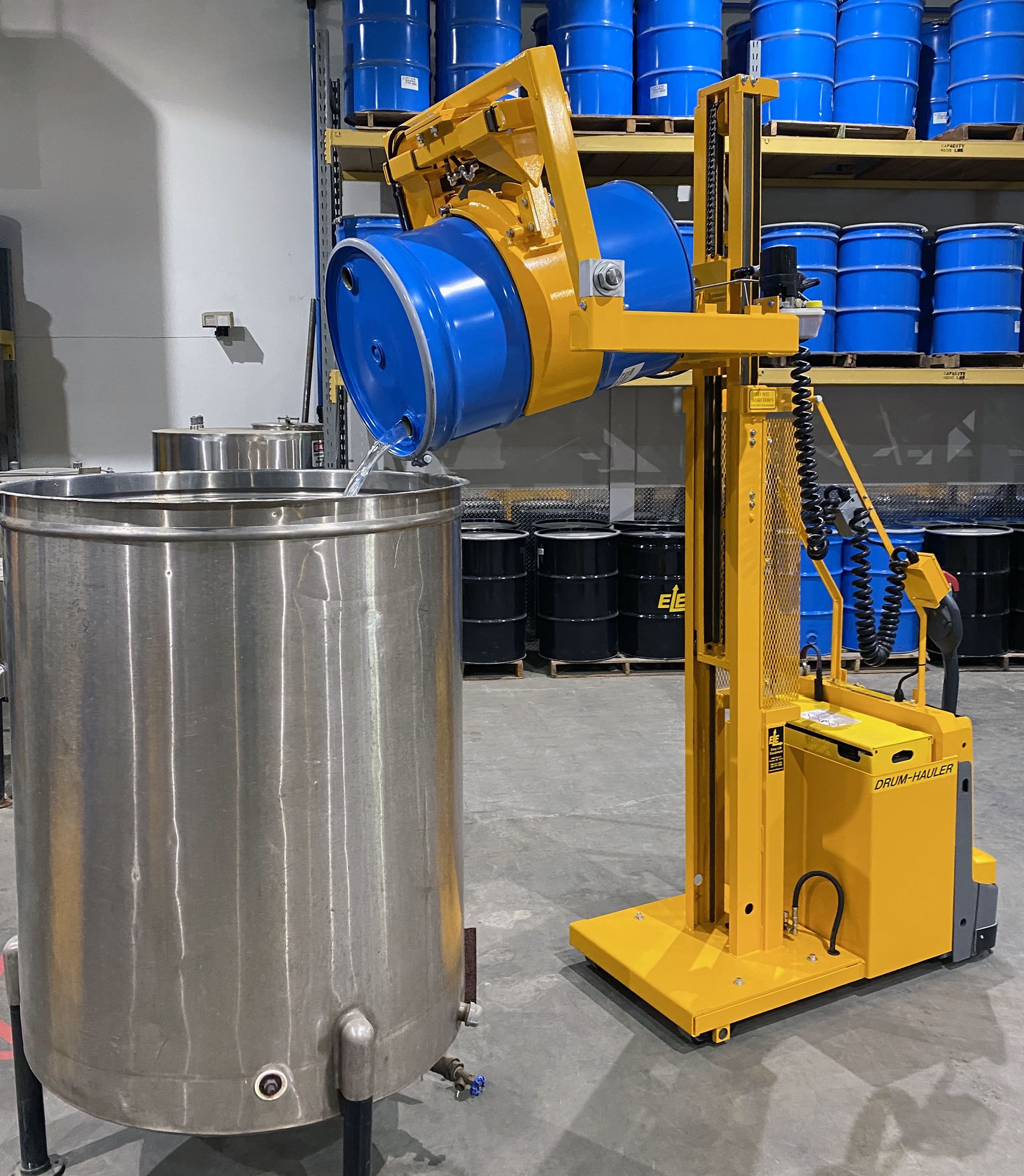 03-Drum-Hauler-with-2-stage-mast-and-drum-being-poured-in-tank-min